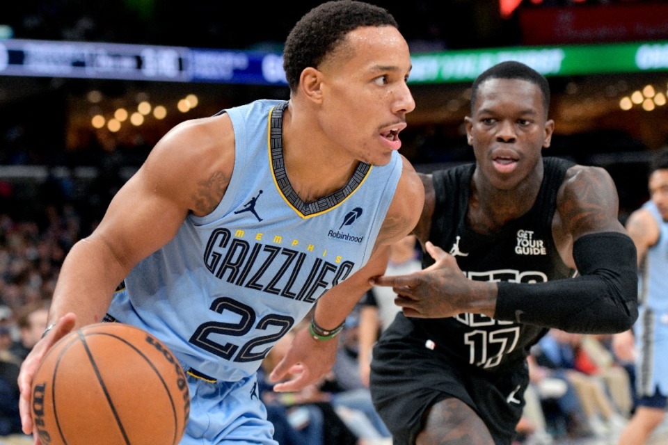 <strong>Memphis Grizzlies guard Desmond Bane (22) charges past Brooklyn Nets guard Dennis Schroder (17) on Friday, Dec. 13, 2024. Bane finished with 21 points.</strong> (Brandon Dill/AP)