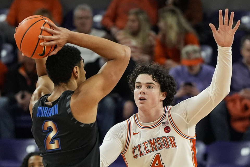 <strong>Memphis forward Nicholas Jourdain (2) works against Clemson forward Ian Schieffelin (4) during the first half of an NCAA basketball game on Saturday, Dec. 14, in Clemson, S.C.</strong> (Mike Stewart/AP file)