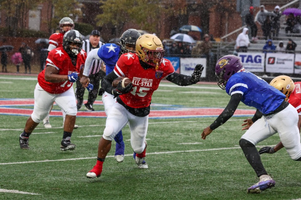 <strong>Red Team running back Rhyan Brown (15) runs with the ball during the AutoZone Liberty Bowl High School All-Star Game on Dec. 14, 2024.</strong> (Wes Hale/Special to The Daily Memphian)