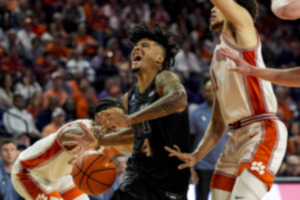 <strong>Memphis guard PJ Haggerty (4) battles for the ball against Clemson during the first half of an NCAA basketball game, Saturday, Dec. 14, 2024, in Clemson, S.C.</strong> (Mike Stewart/AP Photo)