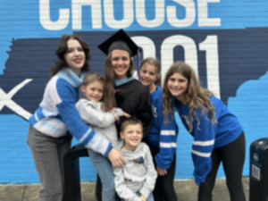 <strong>Elisabeth &ldquo;Buffy&rdquo; Claire Langford, center, surrounded by her kids on her graduation day Sunday, Dec. 15, 2024.</strong> (Courtesy Karen Pulfer Focht)