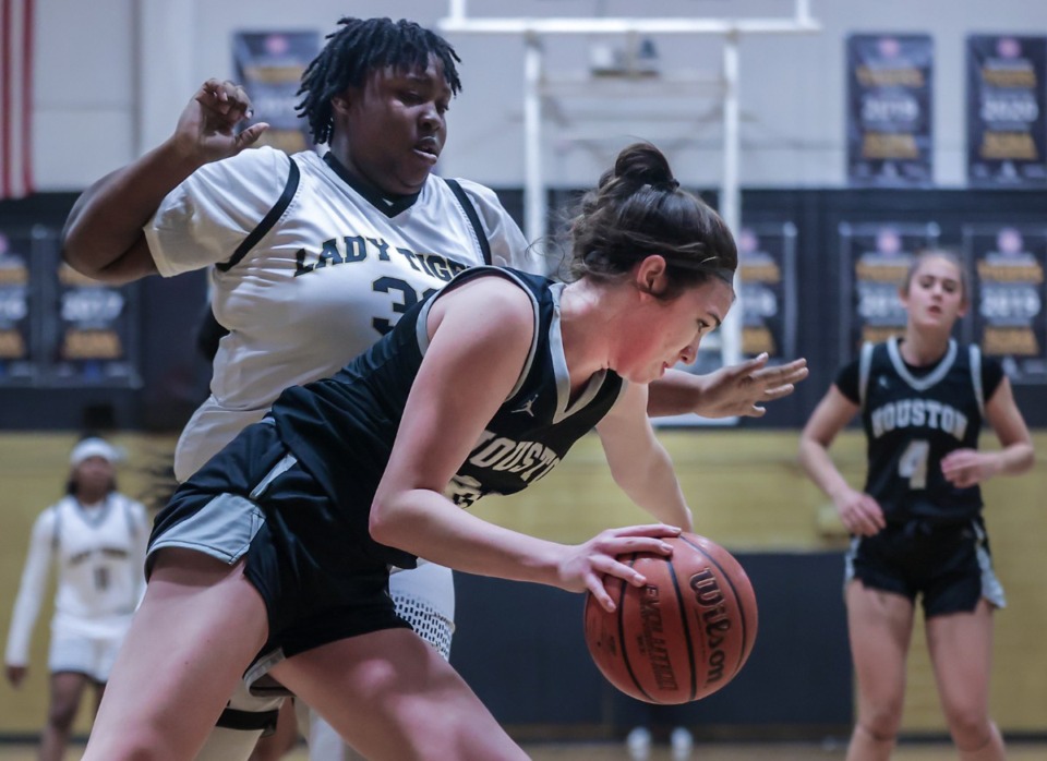 <strong>Houston's Mckenzie Percoski (31) brings the ball up the court against Whitehaven's Arianna Buford (33) during a Feb. 24, 2023 game.</strong> (Patrick Lantrip/The Daily Memphian file)