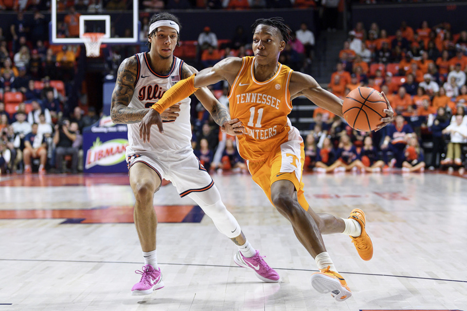 <strong>Tennessee's Jordan Gainey drives past Illinois' Tre White during an NCAA college basketball game Saturday, Dec. 14, 2024, in Champaign, Ill.</strong> (Craig Pessman/AP Photo)