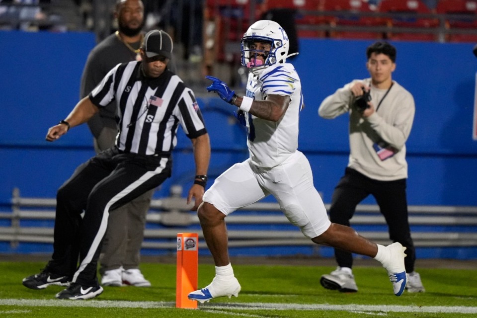 <strong>Memphis running back Greg Desrosiers Jr. (13) rushes for a touchdown against West Virginia din the Frisco Bowl on Tuesday, Dec. 17, 2024, in Frisco, Texas.</strong> (LM Otero/AP)