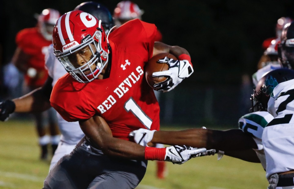 <strong>Germantown running back T.J. Dorsey challenges the Cordova defense Friday, Aug. 30, at Germantown.</strong> (Mark Weber/Daily Memphian)