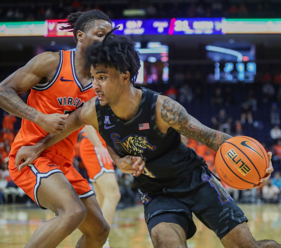 <strong>Memphis guard PJ Haggerty (4) led the Tigers against Virginia with 27 points. </strong>(Cal Cary/The Daily Progress via AP)