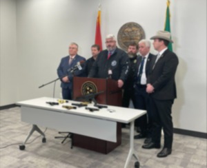 <strong>Johnie Carter, director of the West Tennessee Drug Task Force, speaks to reporters along-side Shelby County District Attorney General Steve Mulroy and District Attorneys General Frederick Agee (right) and Danny Goodman, Jr. (left). </strong>(Aarron Fleming/The Daily Memphian)