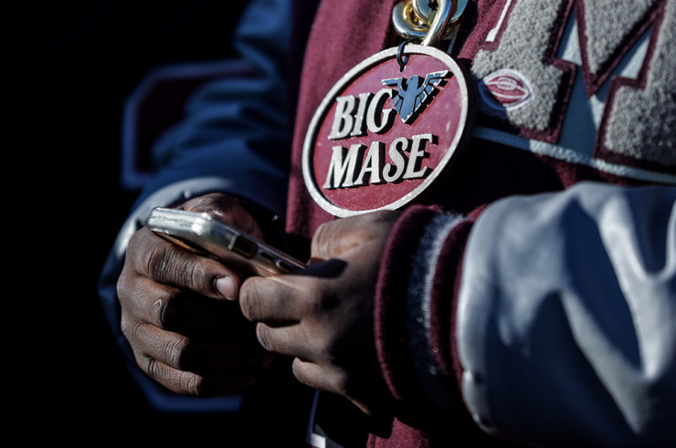 <strong>A MASE football player shows off his chain during a parade along Poplar Avenue celebrating the school's first state championship Dec. 20.</strong> (Patrick Lantrip/The Daily Memphian)