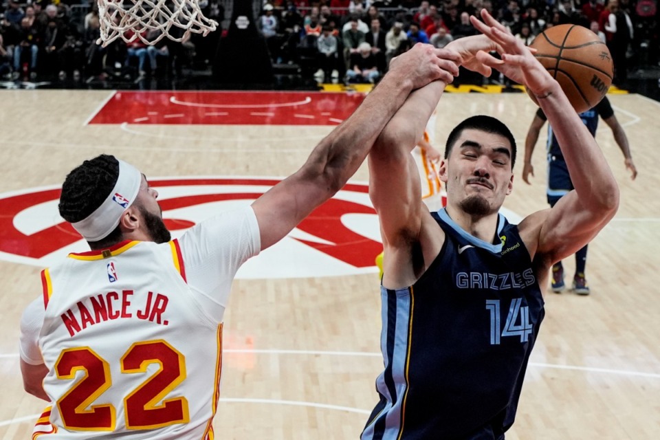 <strong>Atlanta Hawks forward Larry Nance Jr. (22) blocks a shot by Memphis Grizzlies center Zach Edey (14) during the first half of an NBA basketball game, Saturday, Dec. 21, 2024, in Atlanta.</strong> (Mike Stewart/AP)