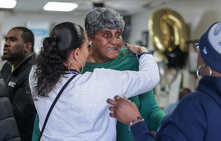 Ms. Girlee's owner Jimmie Leach is greeted by a line of hugs while walking in to her North Memphis restaurant, which closed Friday, Dec. 20, after 10 years. (Patrick Lantrip/The Daily Memphian)