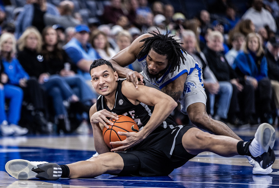 <strong>Memphis dropped out of the AP Top 25 this week after a lopsided loss to Mississippi State. Tigers guard Tyrese Hunter (11) fights for a loose ball with State forward RJ Melendez (22).</strong> (Patrick Lantrip/The Daily Memphian)