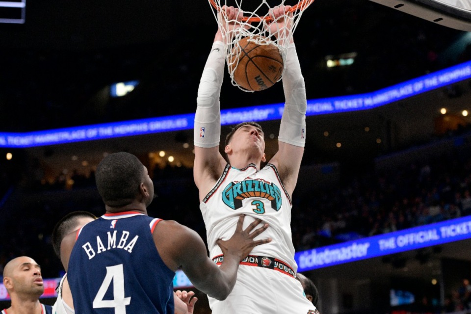 <strong>Memphis Grizzlies forward Jake LaRavia (3) dunks against Los Angeles Clippers center Mo Bamba (4) Monday, Dec. 23, 2024.</strong> (Brandon Dill/AP)