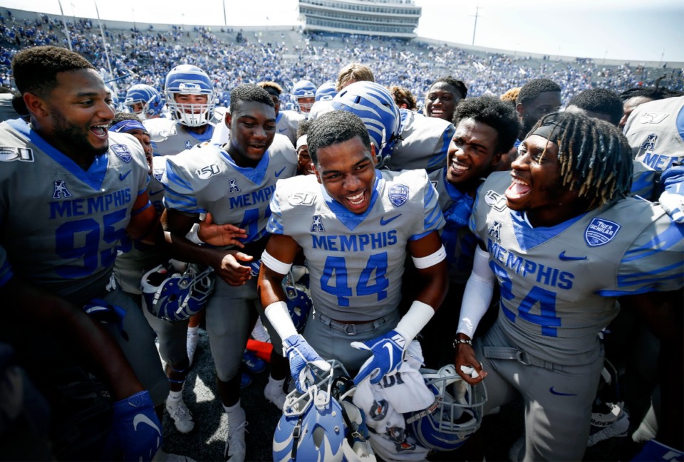 <strong>Memphis defensive back Kendell Johnson (middle) along with his teammates celebrates a 15-10 victory over Ole Miss in their NCAA football game at the Liberty Bowl Memorial Stadium Saturday, August 31, 2019.</strong> (Mark Weber/Daily Memphian)
