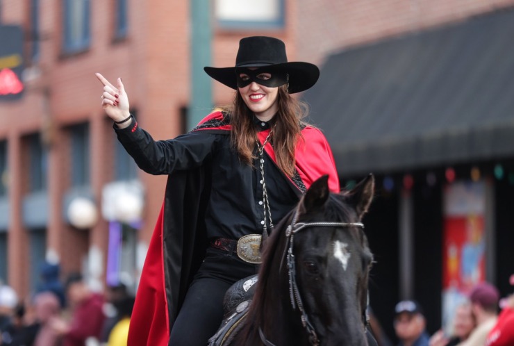 <strong>The Masked Rider trots down Beale Street during the AutoZone Liberty Bowl Parade Dec. 26, 2024.</strong> (Patrick Lantrip/The Daily Memphian)