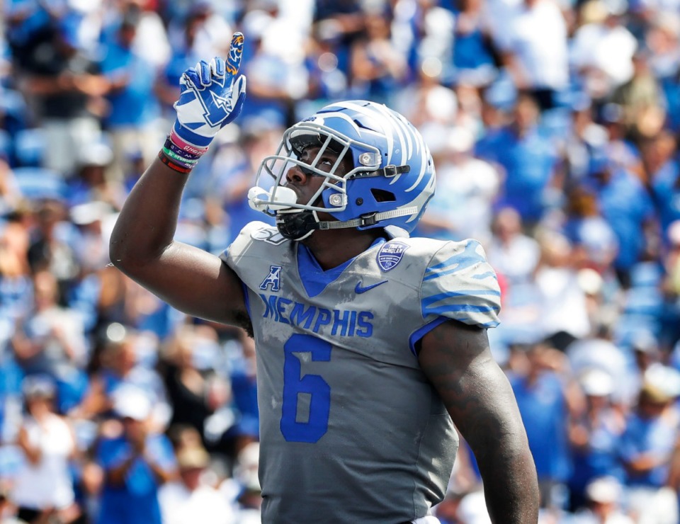 <strong>Memphis running back Patrick Taylor Jr. celebrates a touchdown against the Ole Miss defense during action in their NCAA football game at the Liberty Bowl Memorial Stadium Saturday, August 31, 2019.</strong> (Mark Weber/Daily Memphian)