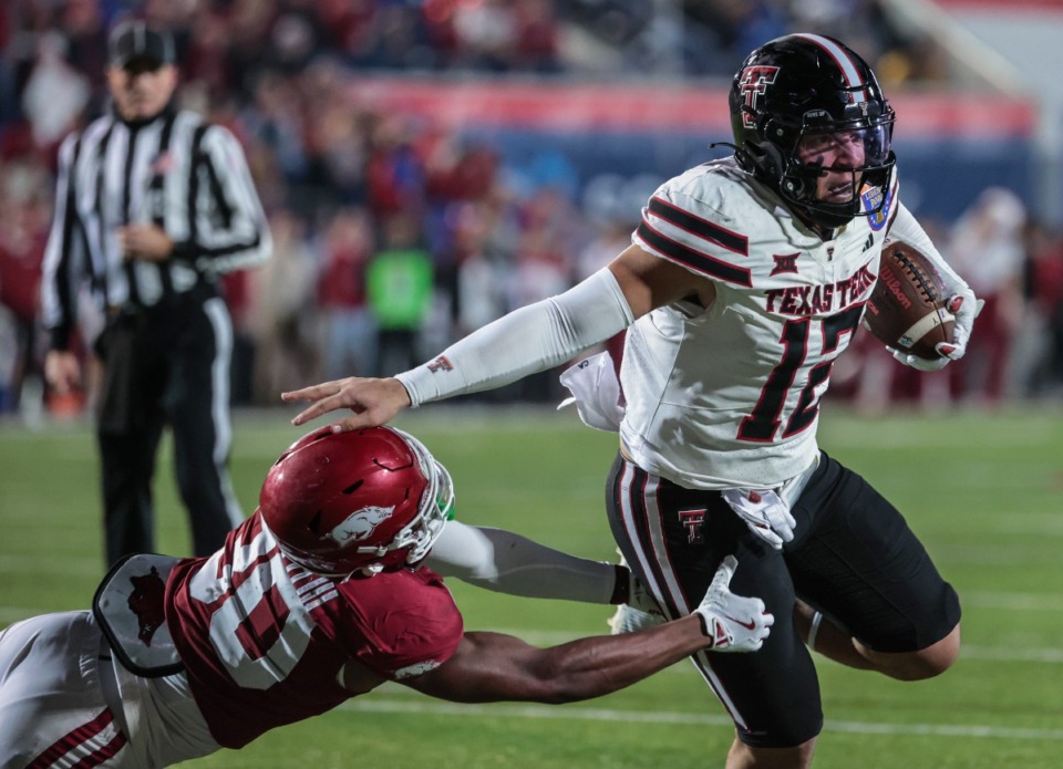 <strong>Texas Tech tight end Jailin Conyers (12) breaks a tackle on his way to a touchdown against Arkansas in the AutoZone Liberty Bowl Dec. 27, 2024.</strong> (Patrick Lantrip/The Daily Memphian)