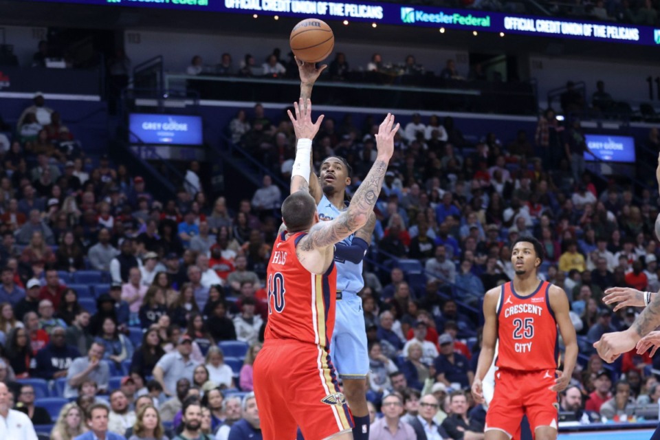 <strong>Memphis Grizzlies guard Ja Morant, center top, shoots a floater over New Orleans Pelicans center Daniel Theis (10) in the first half of an NBA basketball game in New Orleans, Friday, Dec. 27, 2024.</strong> (Peter Forest/AP)