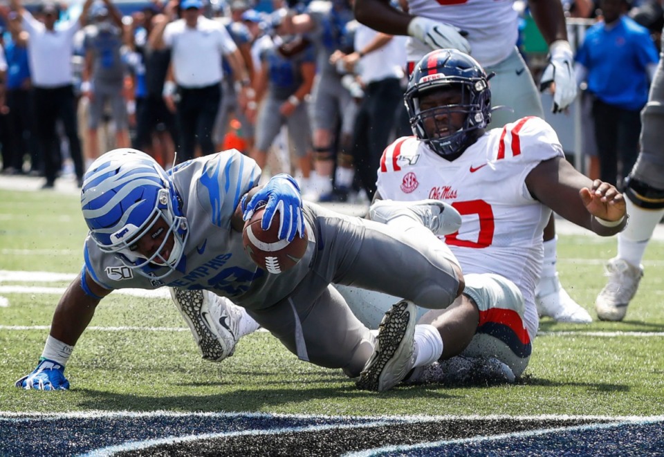 <strong>Memphis running back Kenneth Gainwell (left) reaches for the end zone over Ole Miss defender Josiah Coatney (right) during action in their NCAA football game at the Liberty Bowl Memorial Stadium Saturday, August 31, 2019.</strong> (Mark Weber/Daily Memphian)