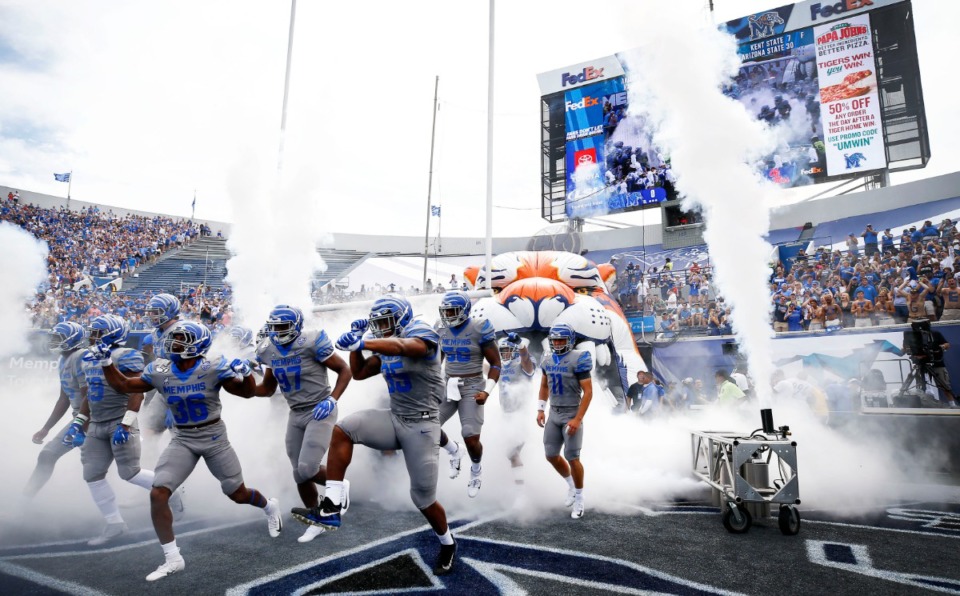 <strong>Memphis Tigers head onto the field for the first game of the season against Ole Miss at the Liberty Bowl Memorial Stadium Saturday, August 31, 2019.</strong> (Mark Weber/Daily Memphian)