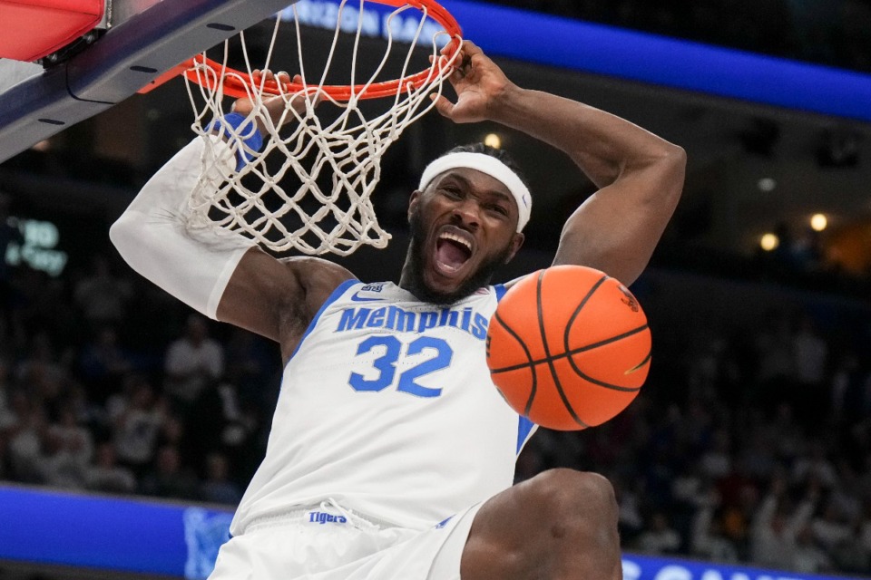 <strong>Memphis center Moussa Cisse (32) dunks the ball during the first half of the Tigers&rsquo; win over Ole Miss&nbsp; on Saturday.</strong> (George Walker IV/AP)