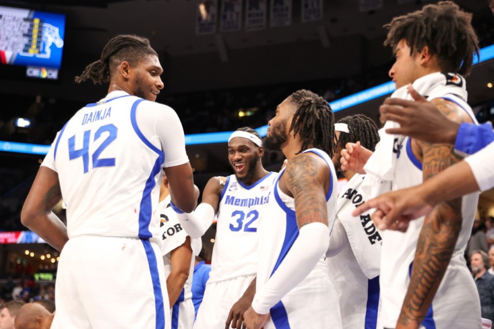 <strong>Memphis Tigers forward Dain Dainja (42) and center Moussa Cisse (32) celebrate during the second half against the Mississippi Rebels at FedExForum on Saturday, Dec. 28, 2024.</strong> (Wes Hale/Special to The Daily Memphian)