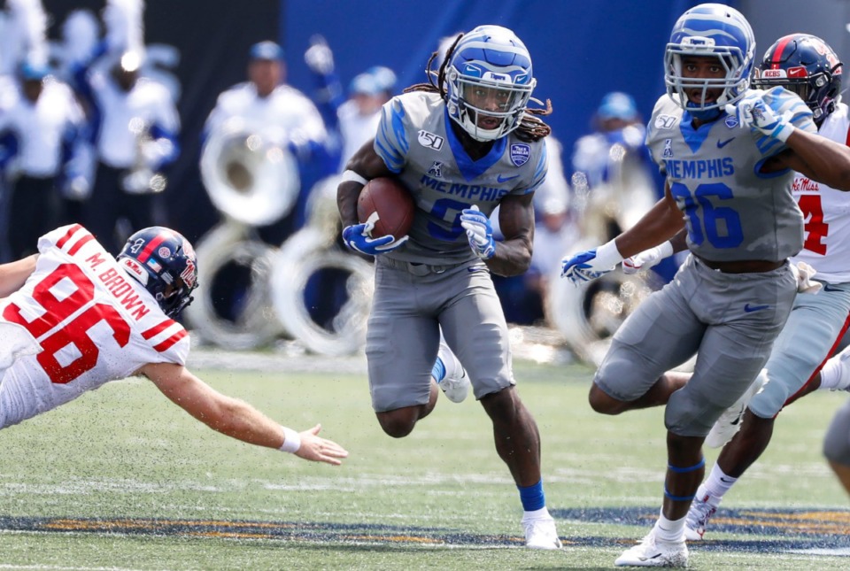 <strong>Memphis receiver Pop Williams (middle) runs a punt return back against Ole Miss during action in their NCAA football game at the Liberty Bowl Memorial Stadium Saturday, August 31, 2019.</strong> (Mark Weber/Daily Memphian)
