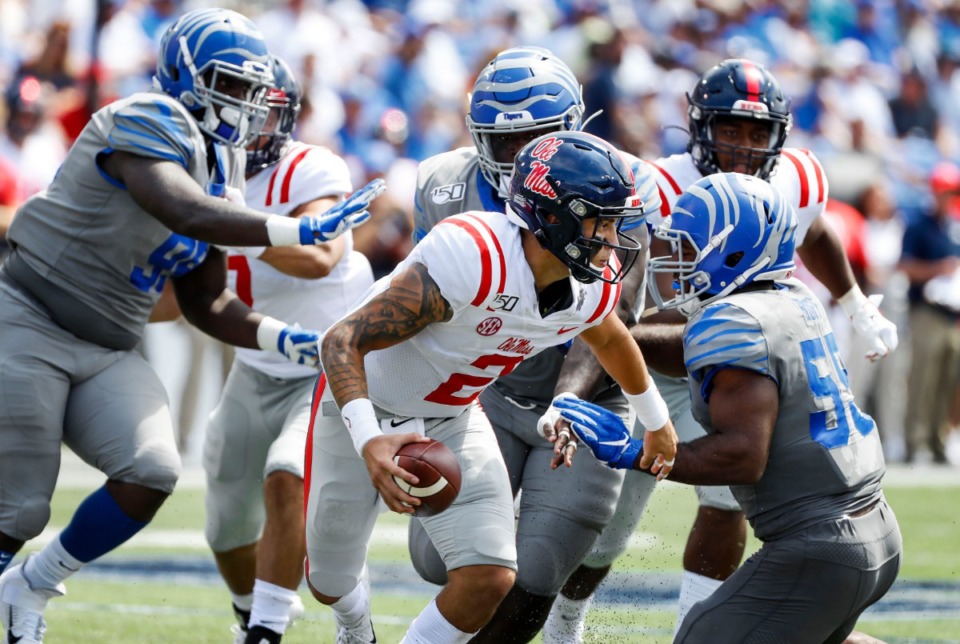 <strong>Ole Miss quarterback Matt Corral tries to get past Memphis players during action in their NCAA football game at the Liberty Bowl Memorial Stadium Saturday, August 31, 2019.</strong> (Mark Weber/Daily Memphian)