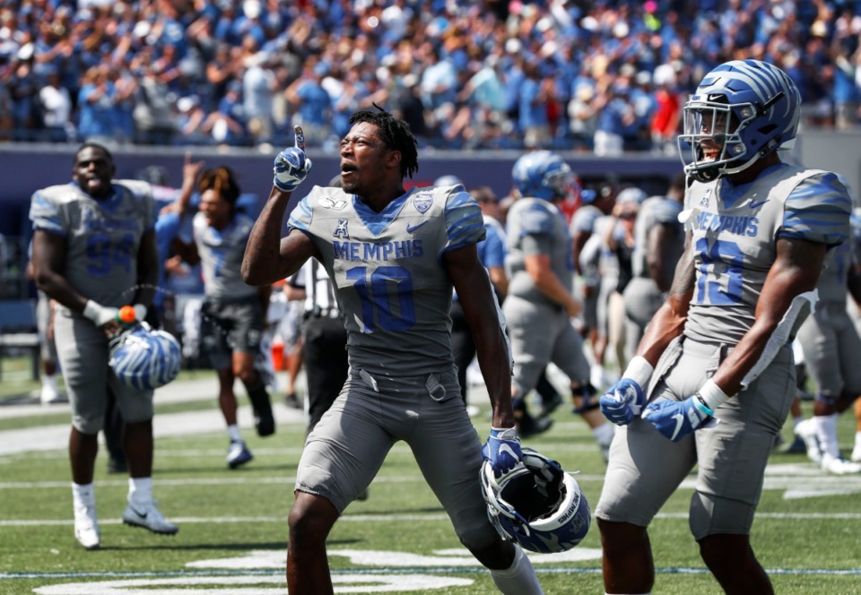 <strong>Memphis receiver Damonte Coxie (middle) celebrates a 15-10 victory over Ole Miss in their NCAA football game at the Liberty Bowl Memorial Stadium Saturday, August 31, 2019.</strong> (Mark Weber/Daily Memphian)