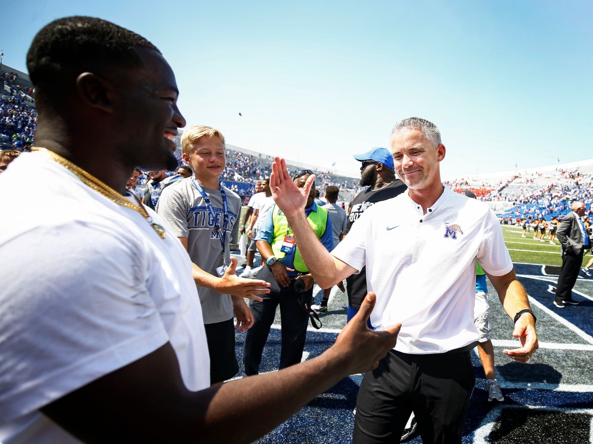 Memphis head coach Mike Norvell (right) celebrates a 15-10 vicotry over Ole Miss in their NCAA football game at the Liberty Bowl Memorial Stadium Saturday, August 31, 2019. (Mark Weber/Daily Memphian)