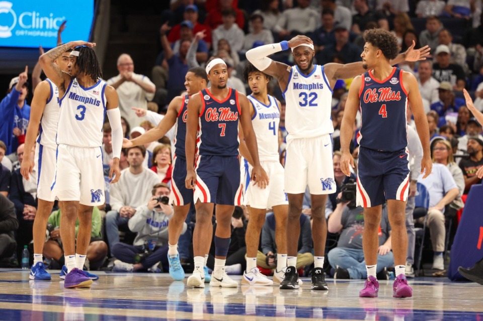 <strong>Memphis Tigers guard Colby Rogers (3) and center Moussa Cisse (32) react to a shot clock violation as Ole Miss Rebels guard Davon Barnes (7) and forward Jaemyn Brakefield (4) looks on during the second half at FedExForum on Saturday, Dec. 28, 2024.</strong> (Wes Hale/Special to The Daily Memphian)