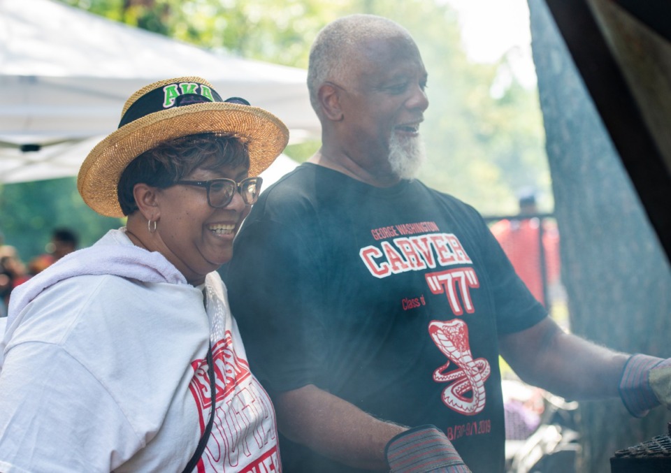 <strong>Felicia Clark Bratcher and Ronny Stewart both from the Carver High School class of 1977, visit during the all-class reunion at Martin Luther King Park.</strong> (Greg Campbell/Special to The Daily Memphian)