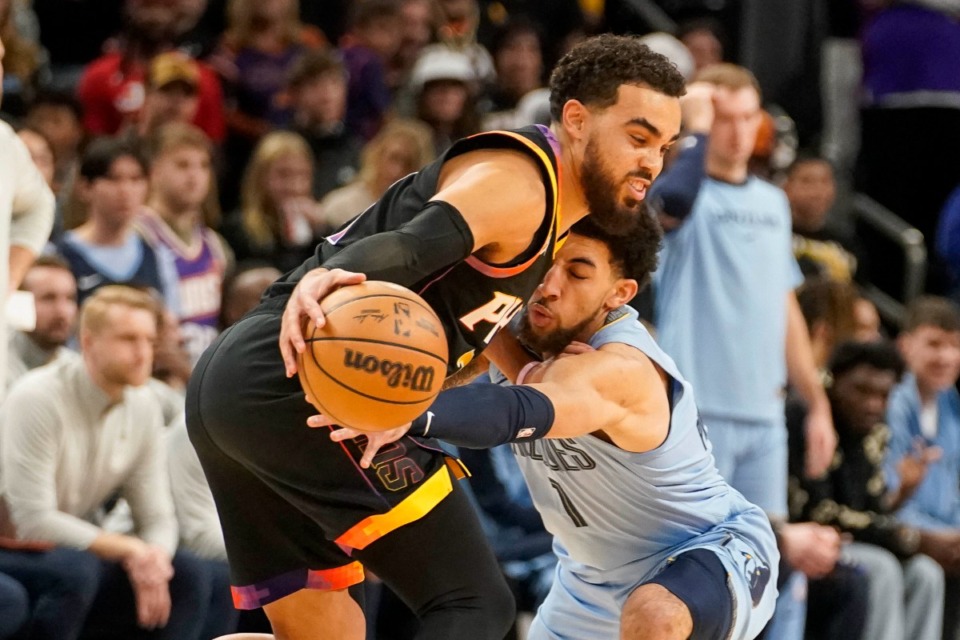 <strong>Memphis Grizzlies guard Scotty Pippen Jr., right, goes for a steal against Phoenix Suns guard Tyus Jones, left, during the first half of an NBA basketball game, Tuesday, Dec. 31, 2024, in Phoenix.</strong> (Darryl Webb/AP)