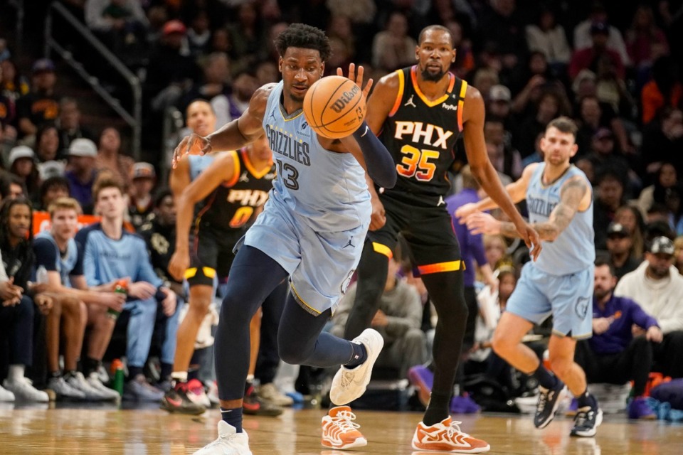 <strong>Memphis Grizzlies forward Jaren Jackson Jr. (13) gets to the ball in front of Phoenix Suns forward Kevin Durant (35) during the game Tuesday, Dec. 31, 2024, in Phoenix. Jackson played 38 minutes and scored 38 points to help the Grizzlies get the win.</strong> (Darryl Webb/AP)