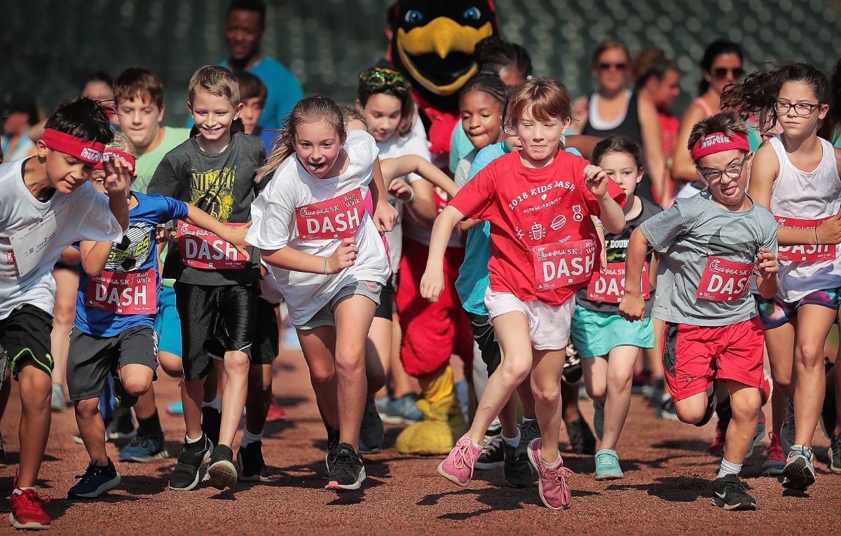 <strong>It's a dog-eat-dog start as young runners take off during the Kids Dash at AutoZone Park part of the activities planned around the 17th Annual Chick-fil-A 5K benefiting Junior Achievement on September 2, 2019.</strong> (Jim Weber/Daily Memphian)