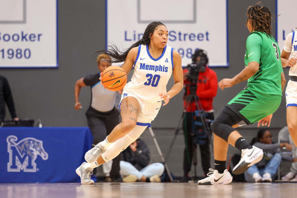 <strong>Memphis Tigers forward Alasia Smith (30) drives the ball against North Texas at the Elma Roane Fieldhouse on Saturday, Jan. 4, 2025.</strong> (Wes Hale/Special to The Daily Memphian)