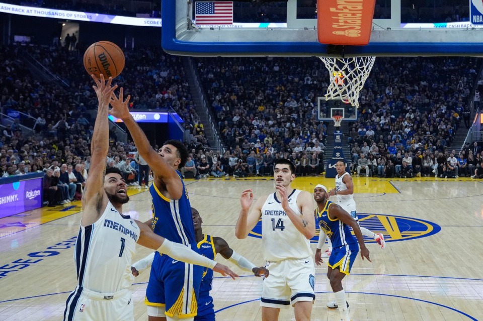 <strong>Memphis Grizzlies guard Scotty Pippen Jr. (1) shoots while defended by Golden State Warriors center Trayce Jackson-Davis, second from left, during the first half of an NBA basketball game Saturday, Jan. 4, 2025, in San Francisco.</strong> (Godofredo A. V&aacute;squez/AP)