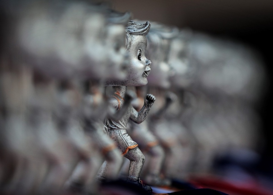 <strong>Trophies for runners in different age divisions line the awards table at AutoZone Park before the start of the 17th Annual Chick-fil-A 5K benefiting Junior Achievement on September 2, 2019.</strong> (Jim Weber/Daily Memphian)