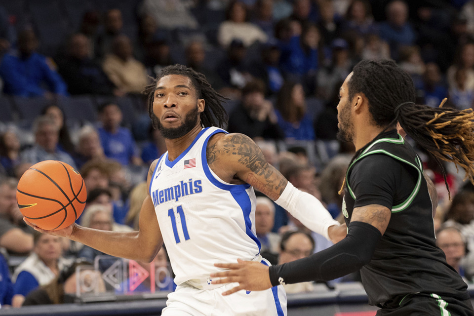 <strong>Memphis guard Tyrese Hunter (11) looks to pass defended by North Texas guard Latrell Jossell, right, during the first half of an NCAA college basketball game Sunday, Jan. 5, 2025, in Memphis.</strong> (Nikki Boertman/AP Photo)