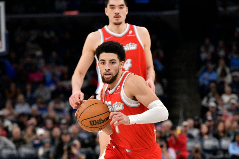 <strong>Memphis Grizzlies guard Scotty Pippen Jr. (1) brings the ball up court ahead of center Zach Edey (14) on Monday, Jan. 6, 2025. Pippen finished with 18 points.</strong> (Brandon Dill/AP)