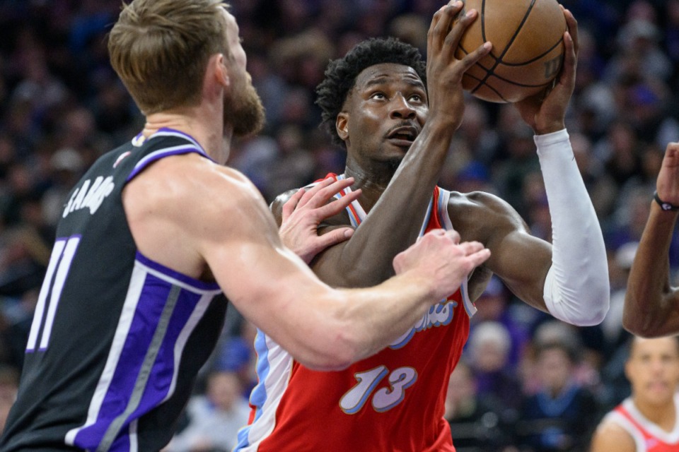 <strong>Memphis Grizzlies forward Jaren Jackson Jr. (13) drives past Sacramento Kings forward Domantas Sabonis, left, during the first half of an NBA basketball game in Sacramento, Calif., Friday, Jan. 3, 2025.</strong> (AP Photo/Randall Benton)