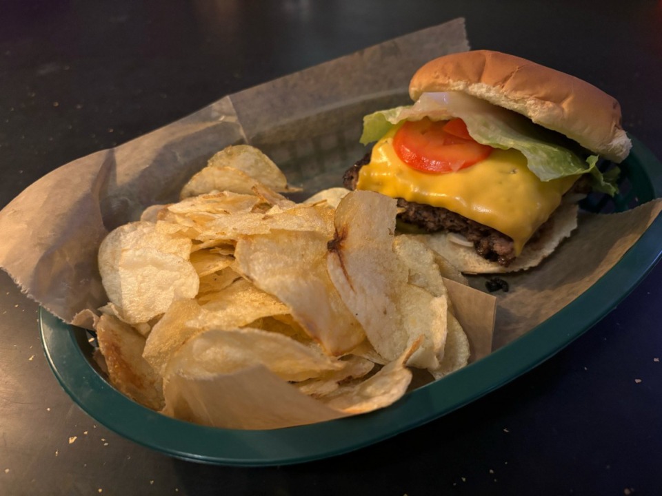 <strong>Lamplighter Lounge&rsquo;s cheeseburger is a&nbsp;thick, hand-formed patty cooked to order and draped with a slice of perfectly melted American cheese.</strong> (Joshua Carlucci/Special to The Daily Memphian)