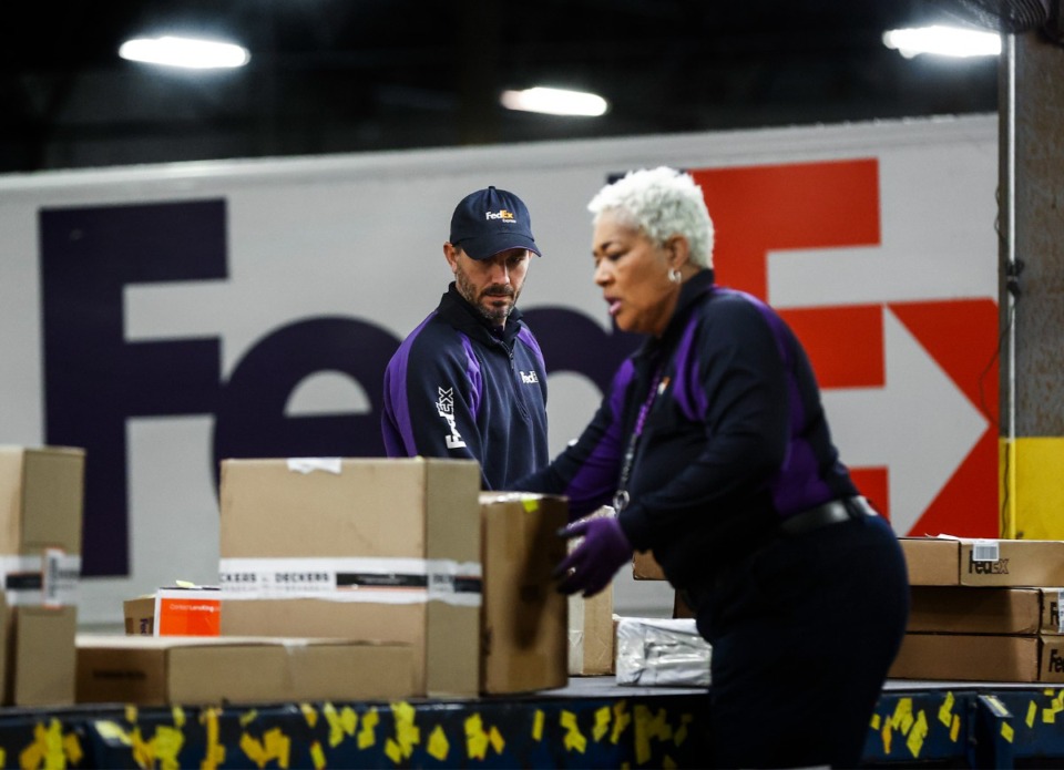 <strong>FedEx handlers sort packages at their Cordova center location on Tuesday, Dec. 5, 2023.</strong> (Mark Weber/The Daily Memphian file)&nbsp;