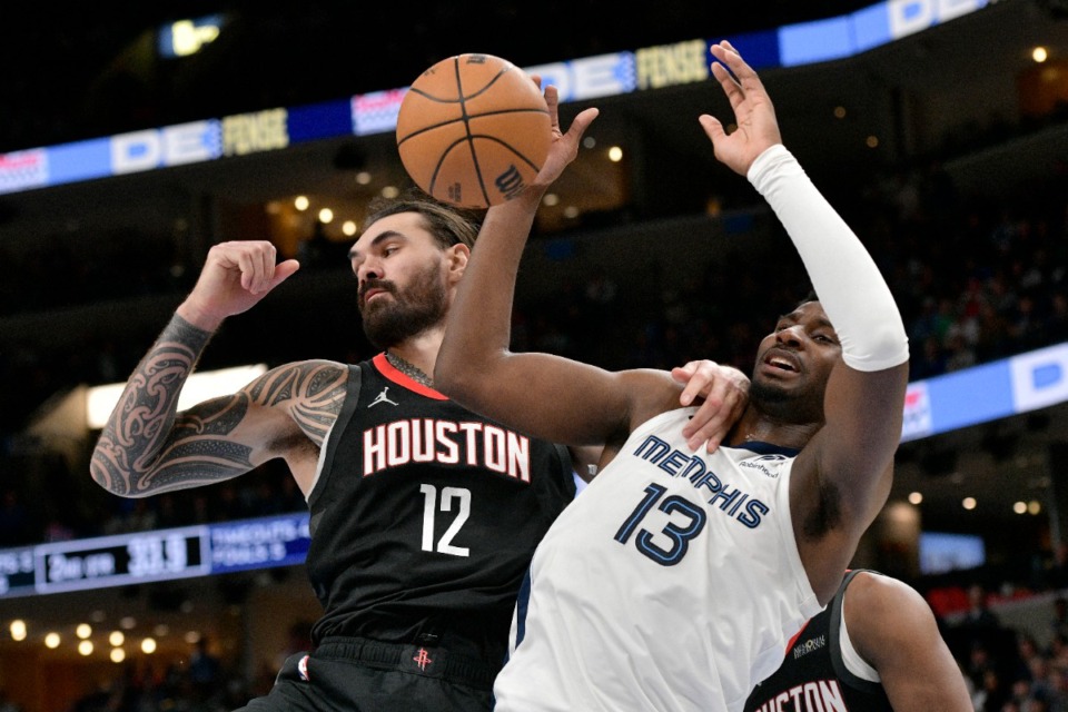 <strong>Houston Rockets center (and former Grizzly) Steven Adams (12) and Memphis Grizzlies forward Jaren Jackson Jr. (13) battle for a rebound on Thursday, Jan. 9, 2025.</strong> (Brandon Dill/AP)