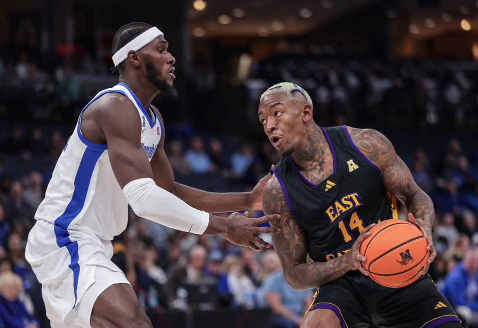 <strong>Memphis center Moussa Cisse defends ECU forward C.J. Walker (14) during a Jan. 11 game.</strong> (Patrick Lantrip/The Daily Memphian)