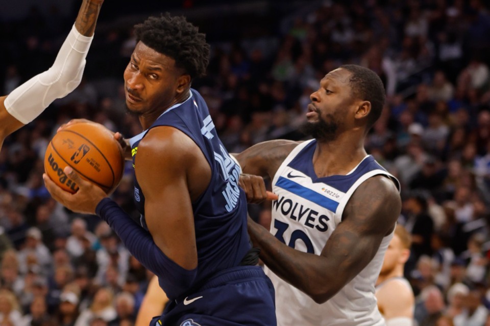 <strong>Memphis Grizzlies forward Jaren Jackson Jr., left, works to the basket as Minnesota Timberwolves forward Julius Randle defends him in the second quarter of an NBA basketball game Saturday, Jan. 11, 2025, in Minneapolis.</strong> (Bruce Kluckhohn/AP)