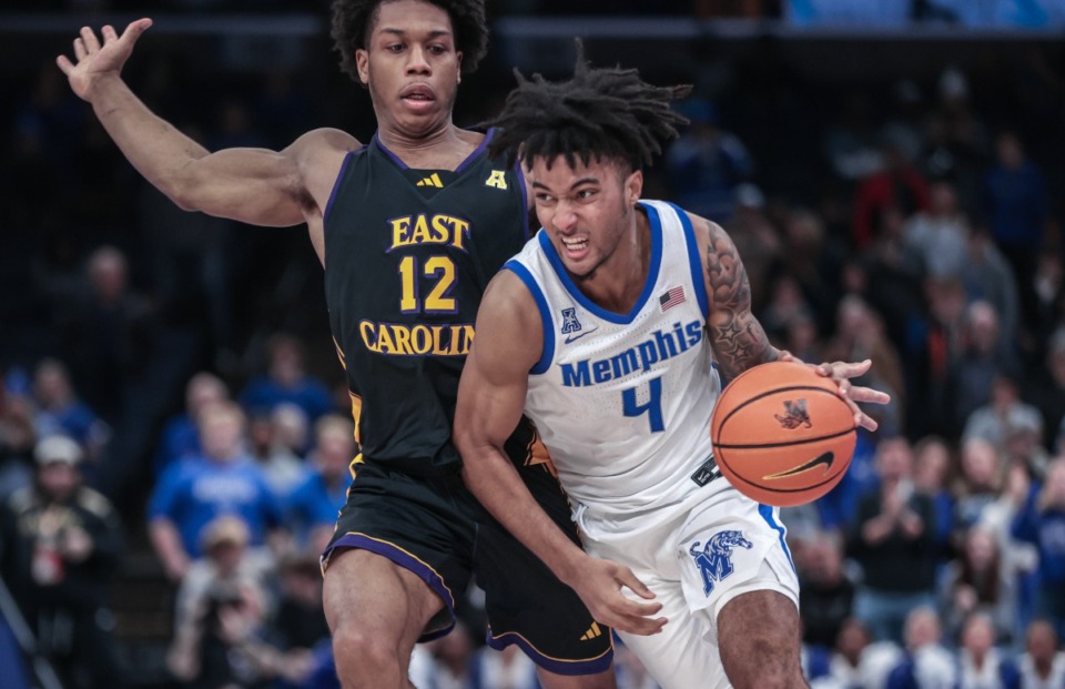 <strong>University of Memphis guard PJ Haggerty (4) drives to the basket during a Jan. 11, 2025 game against ECU.</strong> (Patrick Lantrip/The Daily Memphian file)