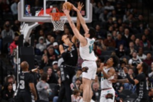 <strong>Memphis Grizzlies center Zach Edey (14) dunks against San Antonio&rsquo;s Victor Wembanyama on Wednesday, Jan. 15, 2025, in San Antonio. Edey defended Wembanyama most of the night.</strong> (Darren Abate/AP)