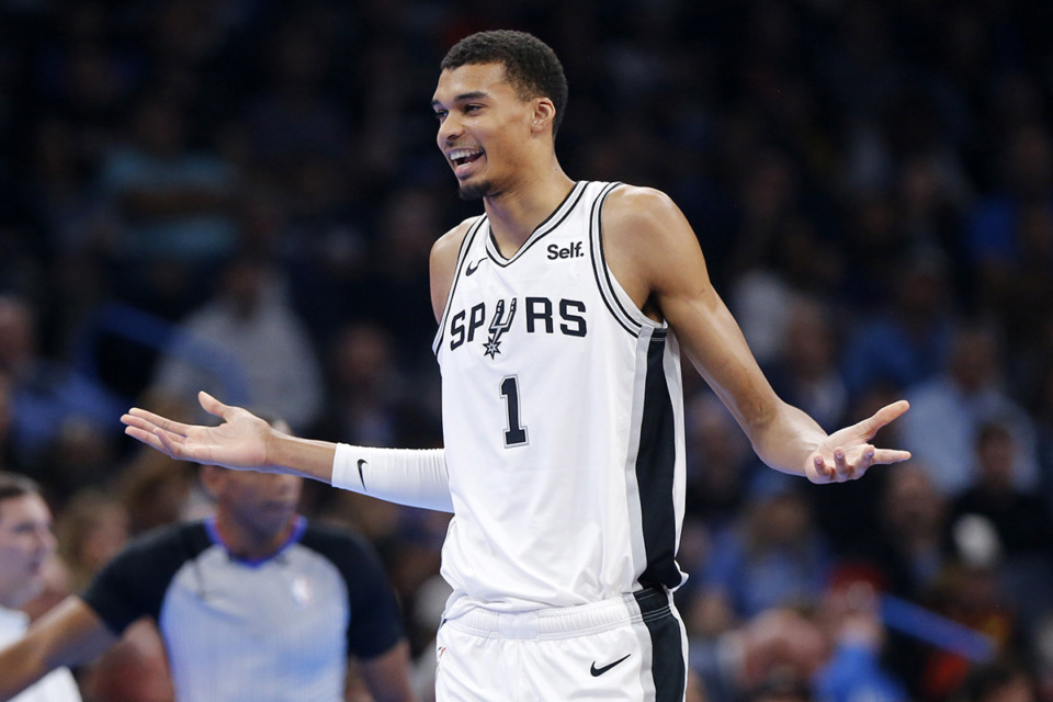 <strong>San Antonio Spurs center Victor Wembanyama holds out his arms after being called for a technical foul during the first half of an NBA in-season tournament basketball game against the Oklahoma City Thunder on Nov. 14, 2023, in Oklahoma City.</strong> (Nate Billings/AP file)