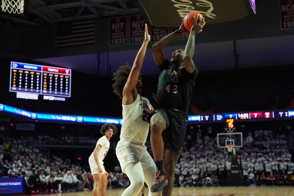 <strong>Memphis Tigers center Dain Dainja (42) goes up for a shot against Temple's Elijah Gray (22) on Thursday, Jan. 16, 2025, in Philadelphia.</strong> (Matt Slocum/AP)