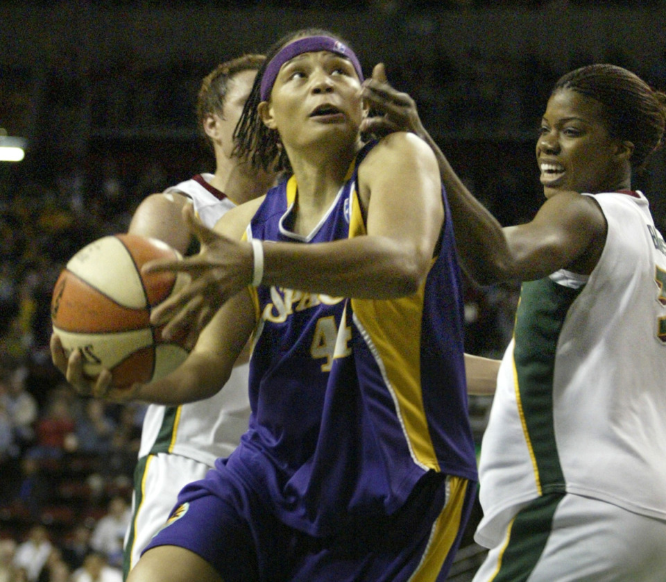 <strong>Tamika Whitmore (with ball) played in the WNBA after her standout career at a Memphis Tiger.</strong> (AP File Photo/Jim Bryant)